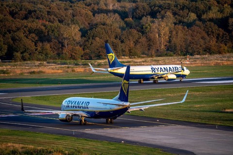Ryanair Boeing 737 taxis to the runway, another Ryanair aircraft taxis for take-off, Cologne-Bonn