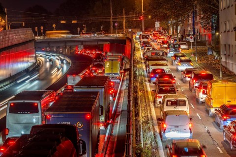 Evening traffic, partly with congestion, slow-moving traffic on the A40 motorway, traffic jam