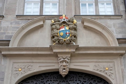 Coat of arms cartouche from 1693 above the portal of the Knauf Museum, market square, Iphofen,