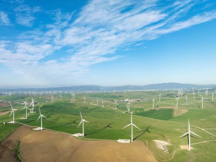 Windmills on a wind farm near Zahara de los Atunes. Aerial view. Drone shot. Cádiz province,