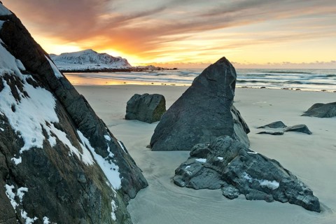 Sunset in winter at Skagsanden, stones on the beach at Flakstad, Flakstadøy, Lofoten, Nordland,