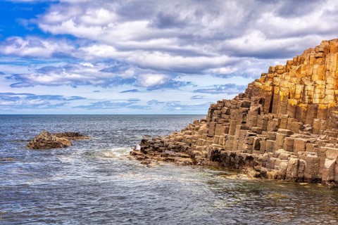 Basaltic rocks on a coastline under dramatic skies, Giant Causeway