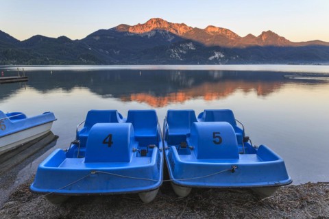 Mountains reflected in lake, pedal boats, morning light, summer, silence, Lake Kochel, Alpine
