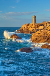 Lighthouse, Phare de Mean Ruz or Phare de Ploumanach, in the foreground rocky coastal landscape,