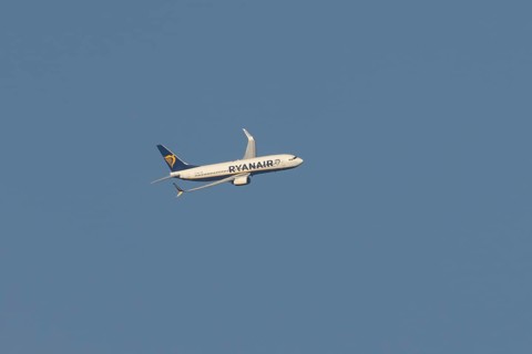 Boeing 737 jet passenger aircraft of Ryanair flying in a blue sky, Rome, Italy, Europe