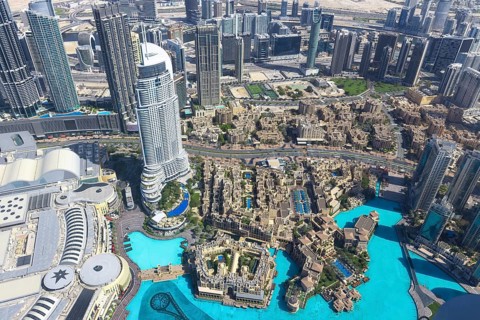 UAE, Dubai panoramic skyline view from Burj Khalifa of city downtown and Dubai Mall.