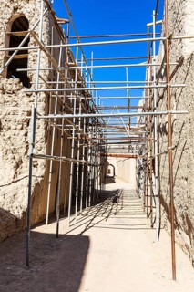 Scaffolding in the largest preserved mud town in Oman, Al Bilaad, Al Bilaad Historical Village,