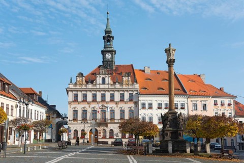 Town hall with clock tower on the market square in baroque style in sunny weather, Town hall and