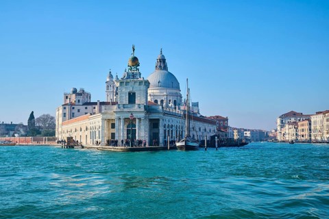 View from the water on church 'Basilica di Santa Maria della Salute' and 'Canal Grande' in Venice