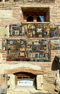Mosaic of picture tiles on the façade of the historic building of the Rezo Gabriadze puppet