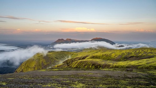 Fog between mountains, moss-covered volcanic mountain landscape, at sunset, Pakgil, Iceland, Europe