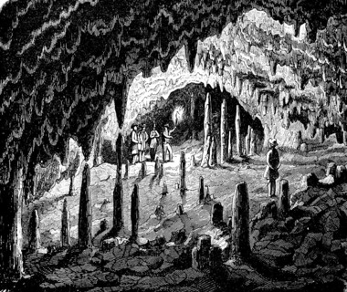 Visitors in a stalactite cave in Westphalia, stalactites, stalagmites, torch, light, history of