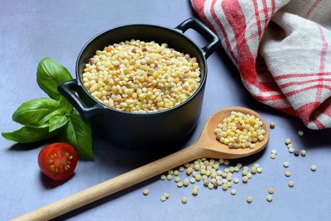 Fregola in pots and spoons, uncooked, pasta variety from Sardinia, Italy, Europe