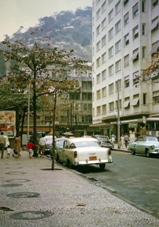Streets, shops, parked cars in Copacabana, Rio de Janeiro, Brazil 1962 Shantytown Favela on a