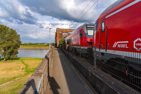 The railway bridge Duisburg-Hochfeld-Rheinhausen, over the Rhine, regional trains and many goods