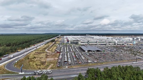 Tesla Giga Factory on the A10 motorway, in the centre of the picture is a photovoltaic system above