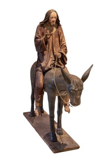 Palm tree donkey, wooden figure from around 1520, on a white background, Diocesan Museum,