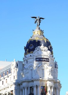 Metropolis building cupola dome with gold and winged angel, Madrid city centre, Spain, architects
