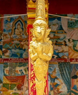 Gilded deity statue, Wat Phonxay, Luang Prabang, Laos, Asia