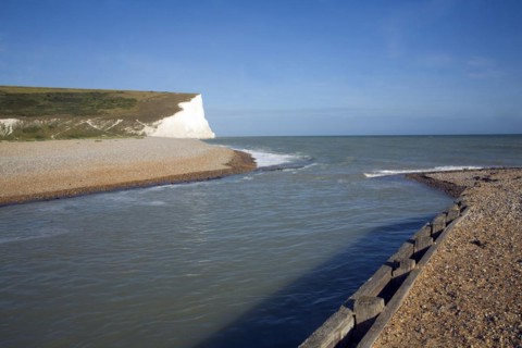 Chalk cliffs of the Seven Sisters from Cuckmere river mouth, East Sussex, England, United Kingdom,