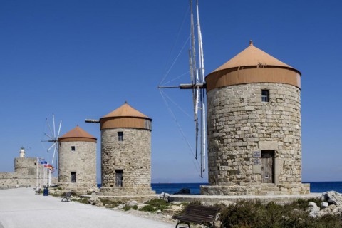 Windmills on the pier at Mandráki harbour, Rhodes Town, Rhodes, Dodecanese, Greece, Europe