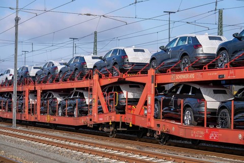Car train, goods train on its way to the car terminal in Bremerhaven seaport, new German cars for
