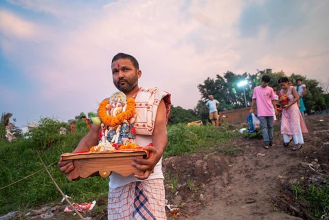 Devotees carries the Ganesha idol to immerse in the Brahmaputra river, during Ganesh Chaturthi