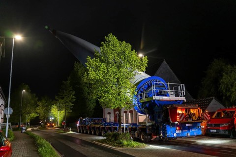 Transport of a 68 metre long, 22 tonne blade of a wind turbine, here in Breckerfeld-Waldbauer, with