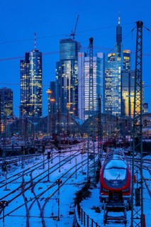 Railway tracks in front of the main railway station in Frankfurt am Main, skyline of skyscrapers in