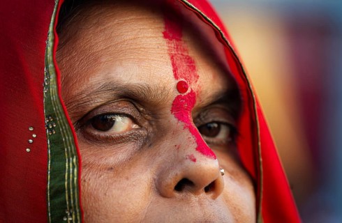 Hindu devotees perform rituals as they offer prayers to the Sun god in the bank of Brahmaputra