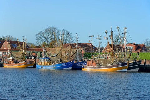 Crab cutter in the harbour of Greetsiel, blue sky, North Sea, Lower Saxony, Germany, Europe