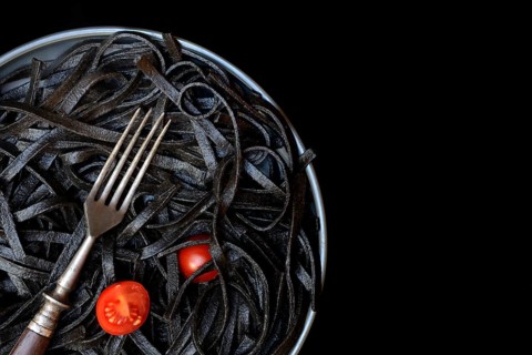 Black pasta coloured with squid ink and fork, Taglioni al Nero di Seppia, Italy, Europe