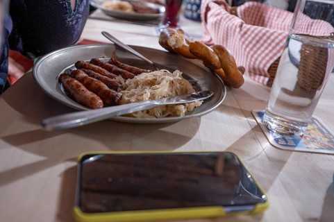 Nuremberg sausages with sauerkraut served on a pewter plate, Nuremberg, Middle Franconia, Bavaria,