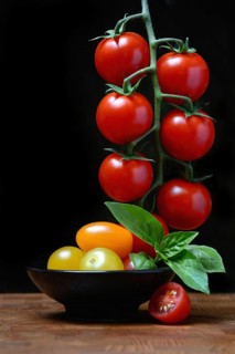 Cherry tomatoes on the stem and in skin, cherry tomato