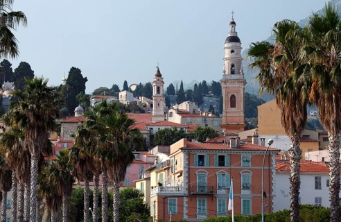The town of Menton reflected in the sea, Menton, Côte d'Azur, Provence, France, Europe