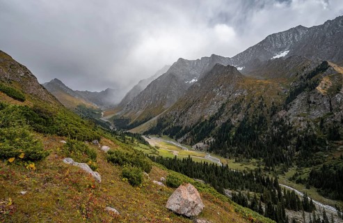 Green mountain valley with river and steep mountain peaks, Chong Kyzyl Suu Valley, Terskey Ala Too,