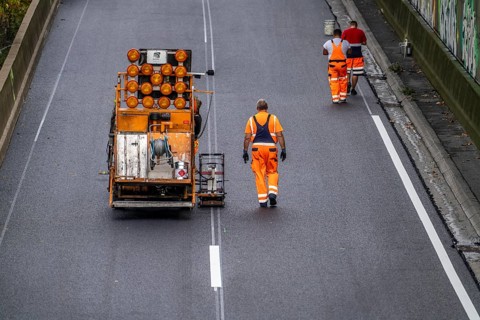 Marking work after the application of new whisper asphalt surface for the A40 motorway, in the