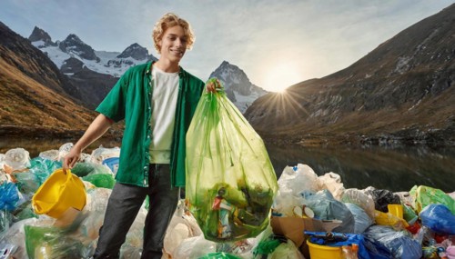Symbolism, rubbish, young man standing with rubbish in front of a rubbish dump, AI-generated, AI
