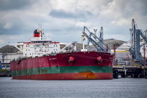 Large tanker for crude oil, Torm Gabriella, being unloaded, in the Petroleumhaven, seaport of