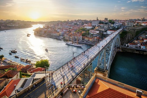 View of Porto city and Douro river and Dom Luis bridge I from famous tourist viewpoint Miradouro da