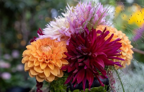 Small bouquet with dahlias in a green vase, Germany, Europe