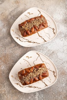 Caramel and almond cake on brown concrete background. top view, flat lay, close up