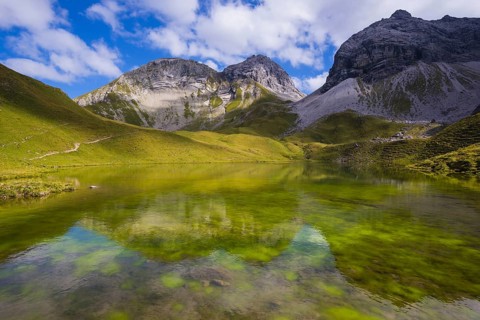 Rappensee, behind it Linkerskopf, 2459m, Rotgundspitze, 2485m, and Hochgundspitze, 2459m, Allgaeu
