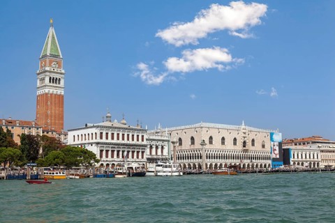 Venice's skyline with iconic bell tower and historic architecture on the canal, Venice, Italy,