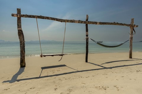 Swing and hammock on the beach of Koh Mook Island, Andaman Sea, Satun Province, Southern Thailand,