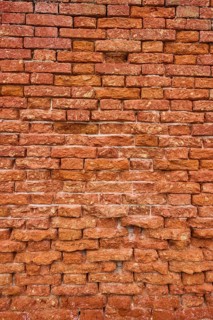 Detail of an old ziggurat wall made of bakestone bricks, Venice Italy