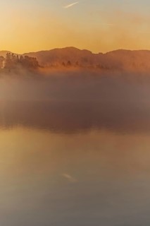 Autumnal morning atmosphere at Schmutter Weiher with fog near Lechbruck, Halblech and Roßhaupten in