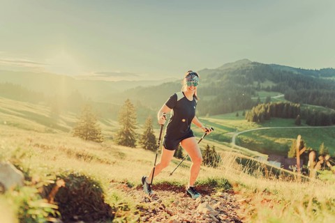Summer trail running and hiking in the Alps on the Riedberg Pass between Obermaiselstein and