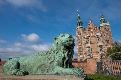 Bronze lion sculpture in front of Rosenborg Palace, 17th century royal palace and museum, Kongens