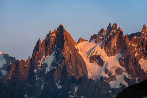 Rocky pointed mountain peaks at sunset, alpenglow, Aiguille du Plan, Mont Blanc massif, Chamonix,
